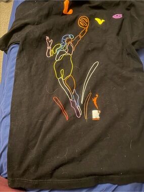 WNBA  “Liberty “ Seattle Storm size small Short sleeve shirt